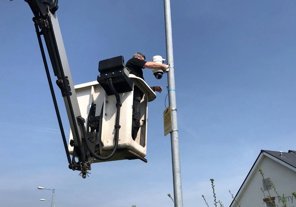 Council Engineer in Cherry Picker Installing a WCCTV Redeployable Camera
