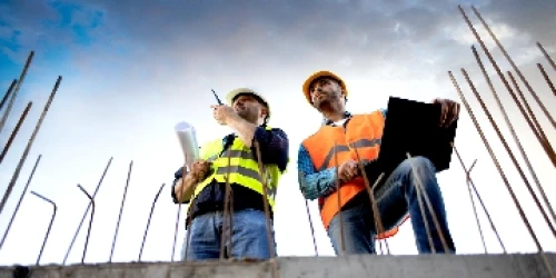 Two Construction Site Workers - Wide Thumb