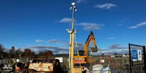 CS tower guarding heavy machinery wide